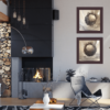 Two of LinZ Kiser's monochromatic nature paintings of acorns displayed in a living room