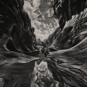 The image is in black and white because it is a photograph of black and white scratchboard art by Lindsey Kiser. The artwork is of a narrow canyon in Red Cliffs National Conservation Area 15 minutes north of St George, Utah. Between the canyon walls is a small triangular glimpse of sky filled with fluffy clouds and beneath is a puddle of water that reflects those clouds. To the left and right of the sky images are soft shades of gray forming smooth, organic forms of the curvilinear canyon walls.